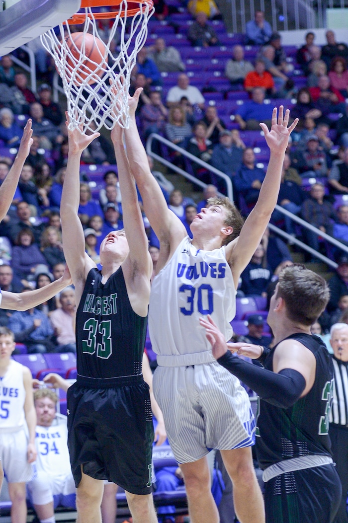 (Leah Hogsten  |  The Salt Lake Tribune) Hillcrest's Devin Adams (33) and Fremont's Dallin Hall (30) fight for the rebound. Fremont defeated Hillcrest 62-52 in the 6A High School Boys' Basketball Tournament opening game at Weber State University’s Dee Events Center in Ogden, Tuesday, Feb. 27, 2018. 