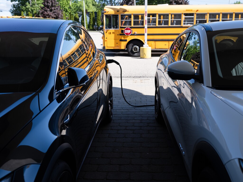 (Tristan Spinski | The New York Times) Electric vehicles for sale at a Green Wave Electric Vehicles dealership, which sells pre-owned electric vehicles, in North Hampton, N.H., May 29, 2024.