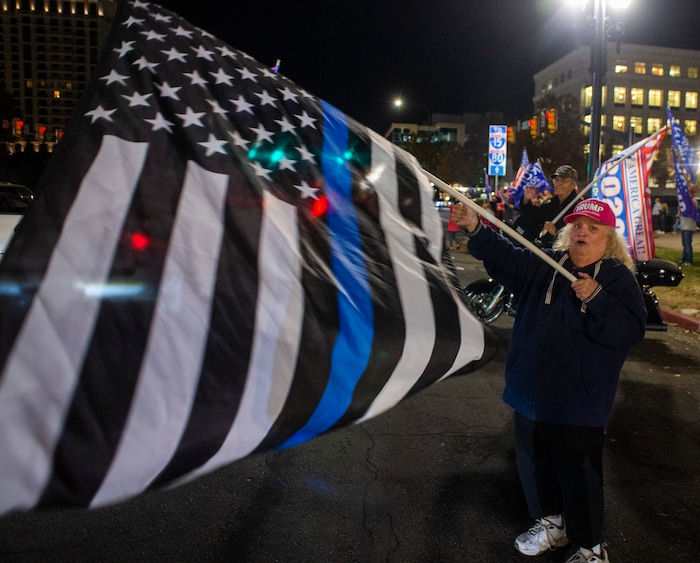 (Rick Egan | The Salt Lake Tribune)  Trump supporters, yell at cars during a rally at Washington Square, on Monday, Nov. 2, 2020.