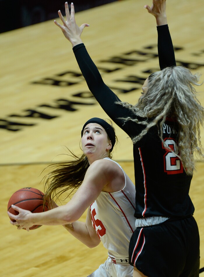 (Francisco Kjolseth  |  The Salt Lake Tribune)  Utah Utes forward Maurane Corbin (25) keeps her eye on the basket as UNLV Rebels forward/center Katie Powell (21) keeps the pressure on as Utah hosts UNLV in women's NCAA basketball at the Huntsman Center, Thursday, March 15, 2018.