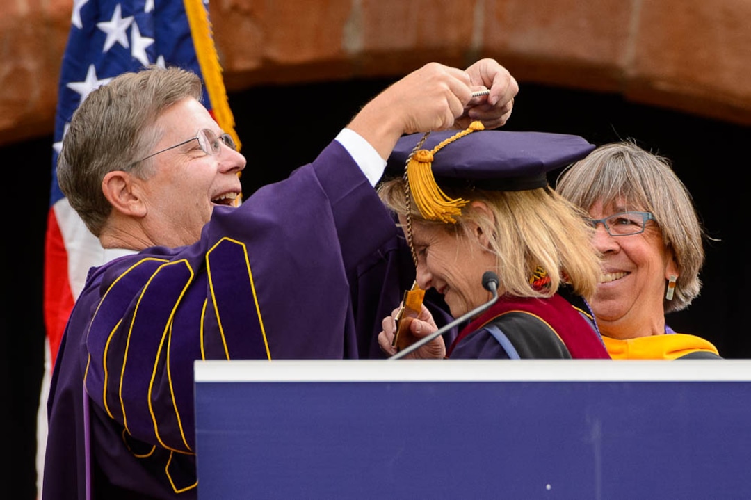 (Trent Nelson | The Salt Lake Tribune)  
Stephen Morgan presents the Presidential Medal to his successor, Bethami Dobkin, who becomes Westminster College's 19th president in front of the school's Converse Hall in Salt Lake City, Saturday, Sept. 29, 2018. At right is Jeanne Ambruster, chair of the Board of Trustees.
