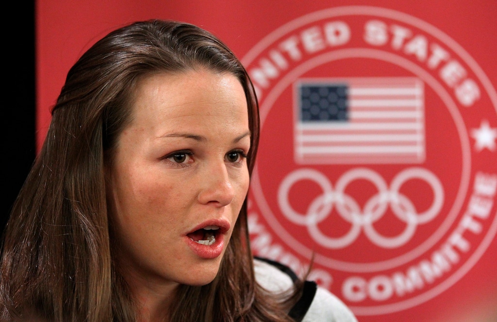 FILE - In this Oct. 1, 2013, file photo, ski-jumper Lindsey Van speaks with reporters during a news conference at the U.S. Olympic Committee media summit in Park City, Utah. Women ski jumpers at the Pyeongchang Olympics are permitted to compete in one event, the normal hill, the men get three: the normal hill, the large hill and a team event. "It's like, 'Here, we'll give you a little piece,' and then, 'Go away, leave us alone,'" says Van, the now-retired American ski jumper who helped lead a discrimination lawsuit to get women jumpers into the Games. "I still think that it's an old boys' club." (AP Photo/Rick Bowmer)