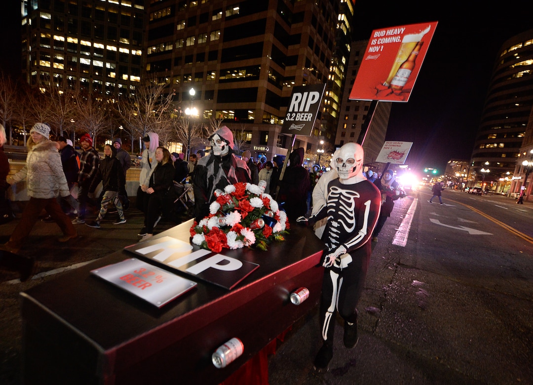 (Francisco Kjolseth  |  The Salt Lake Tribune)  Budweiser’s iconic Clydesdales make a special trip to Utah to celebrate the changing beer laws in the state, joined by a “ghoulish group of pallbearers,” on Wed. Oct. 30, 2019, for a funeral procession for Utah’s last remaining 3.2 percent beer, on their way to Bar X, Beer Bar and Johnny’s on 200 South in Salt Lake City, as the state prepares to start selling 5 percent alcohol-by-volume in grocery and convenience stores starting Friday.