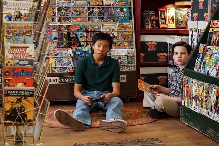 (Photo: Bill Inoshita/CBS) Tam (Ryan Phuong) introduces Sheldon (Iain Armitage) to comic books on “Young Sheldon.”