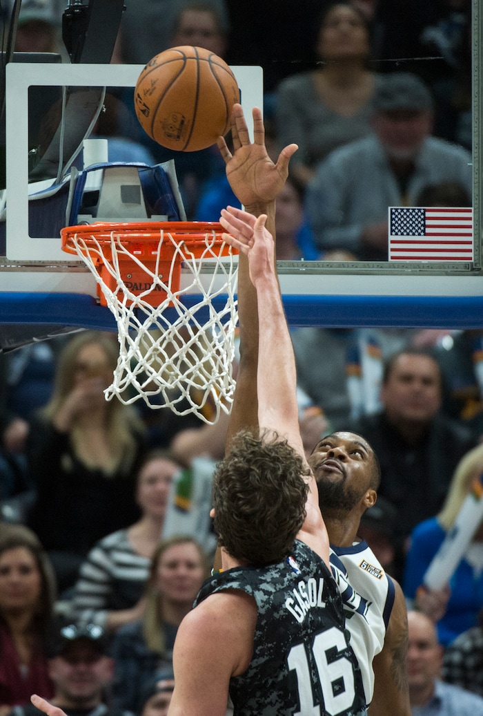 (Rick Egan  |  The Salt Lake Tribune)   Utah Jazz guard Donovan Mitchell (45) is called for goal tending as he blocks a shot by San Antonio Spurs center Pau Gasol (16), in NBA action, in Salt Lake City, Monday, February 12, 2018.