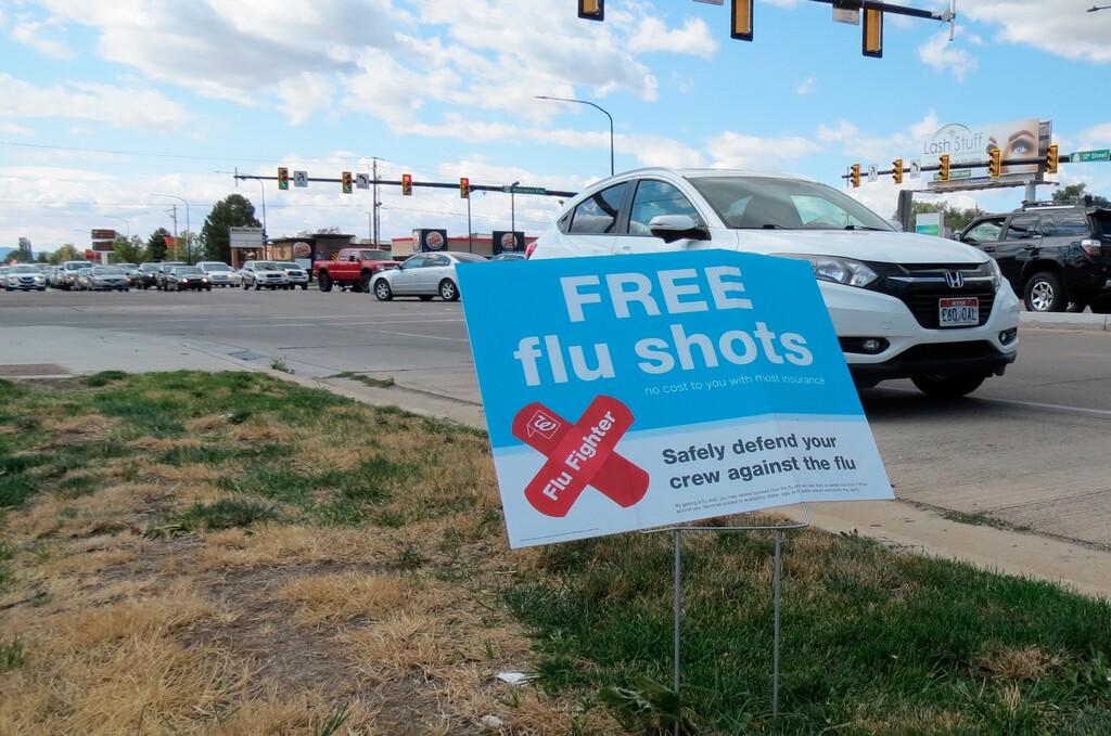 (Tim Vandenack | Standard-Examiner via AP) A sign advertising flu shots is displayed on Tuesday, Sept. 8, 2020, in in Ogden, Utah. The annual flu season is gearing up alongside the coronavirus pandemic, and Utah health officials are encouraging people to get their flu shots.