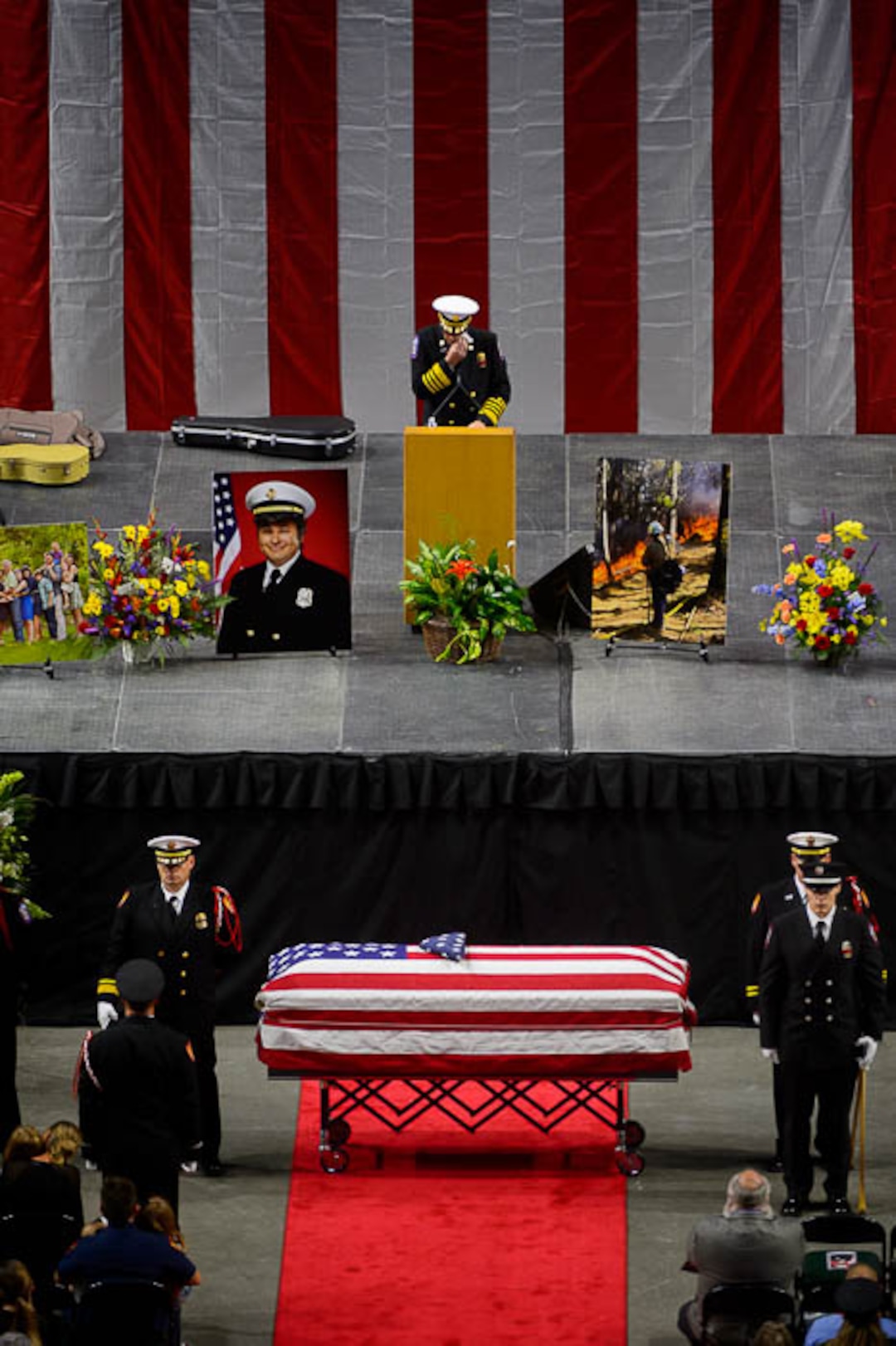 (Trent Nelson | The Salt Lake Tribune)  Funeral services for Battalion Chief Matthew Burchett at the Maverik Center in West Valley City, Monday Aug. 20, 2018.