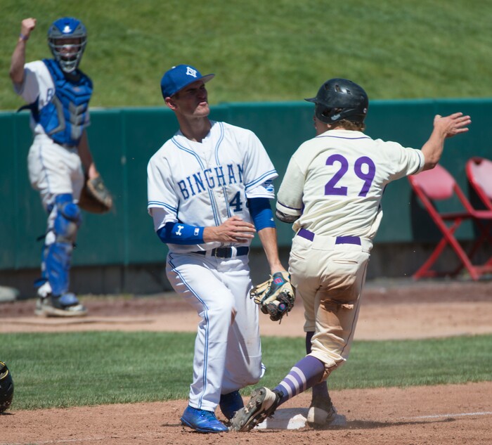 (Rick Egan  |  The Salt Lake Tribune)  Riverton runner Gaige Morris slides into third as Bingham third basemen, Noah Wallick, puts on the tag, in 6A state baseball championship action between Riverton and Bingham, at UVU in Orem, Friday, May 25, 2018.