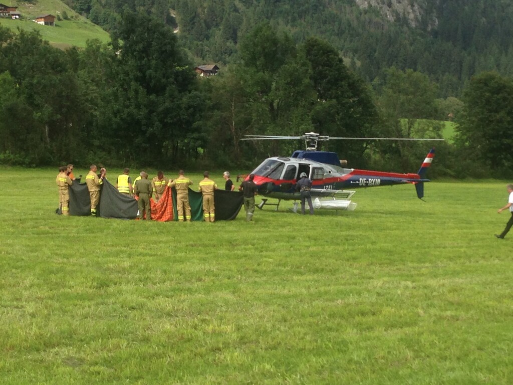 (AP Photo | Franz Brinek) Rescue workers stand next to a police helicopter in Krimml in the Austrian province of Salzburg, Sunday, Aug. 27, 2017. The Austrian Red Cross said five mountain climbers died Sunday in the Austrian Alps in Wildgerlostal on Mount Gabler, east of Innsbruck, and a sixth climber was severely injured, the Austrian news agency APA reported.