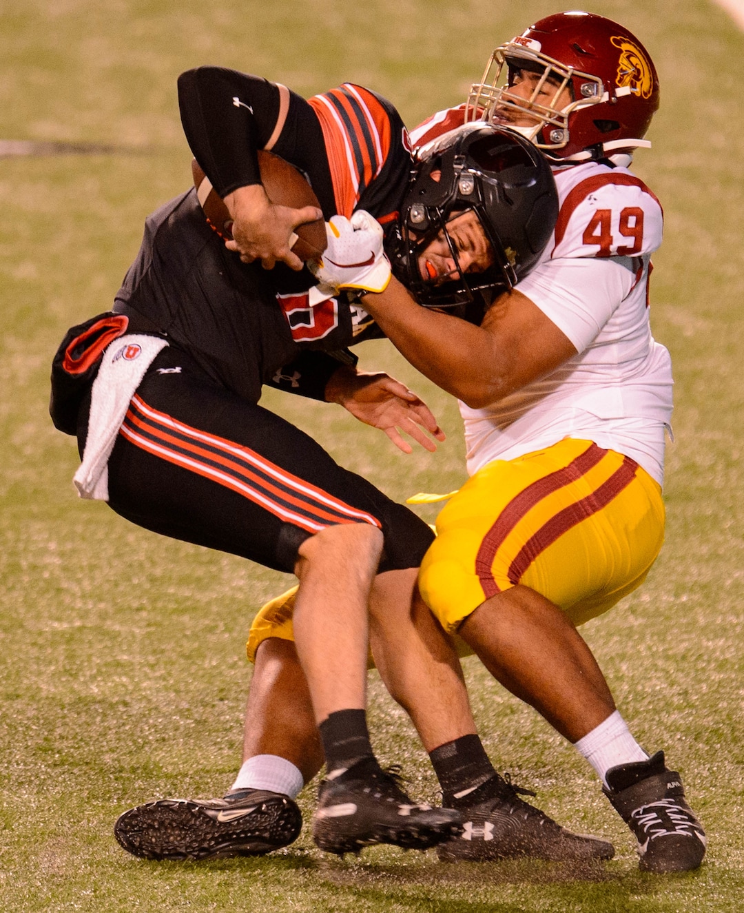 (Trent Nelson  |  The Salt Lake Tribune) USC Trojans defensive lineman Tuli Tuipulotu (49) sacks Utah Utes quarterback Jake Bentley (8), as the Utah Utes host the USC Trojans, NCAA football at Rice-Eccles Stadium in Salt Lake City on Saturday, Nov. 21, 2020.