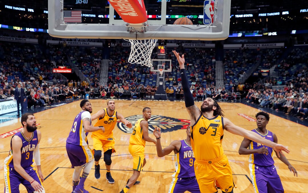 Utah Jazz guard Ricky Rubio (3) goes to the basket in the first half of an NBA basketball game against the New Orleans Pelicans in New Orleans, Monday, Feb. 5, 2018. (AP Photo/Gerald Herbert)