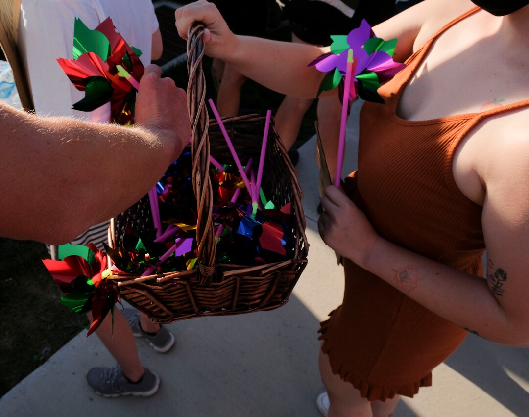 (Leah Hogsten  |  The Salt Lake Tribune) Pinwheels amid calls for a peaceful protest. Five days after after nine protesters were arrested during a peaceful rally in memory of Zane James that turned into a violent clash with Cottonwood Heights officers, demonstrators gathered outside the police station Friday to denounce CHPD's actions and its officers for inciting the violence.