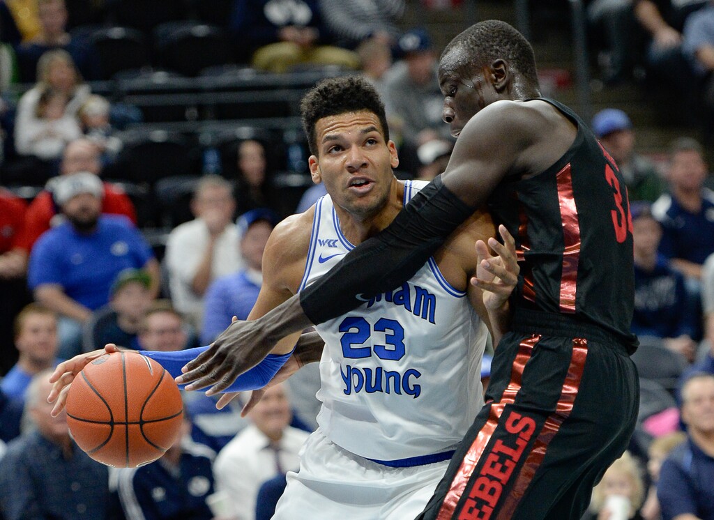 (Francisco Kjolseth | The Salt Lake Tribune) Brigham Young Cougars forward Yoeli Childs (23) tries to push past UNLV Rebels forward Cheikh Mbacke Diong (34) as BYU takes on UNLV in men's NCAA basketball at Vivint Smart Home Arena in Salt Lake City on Sat. Dec. 7, 2019.