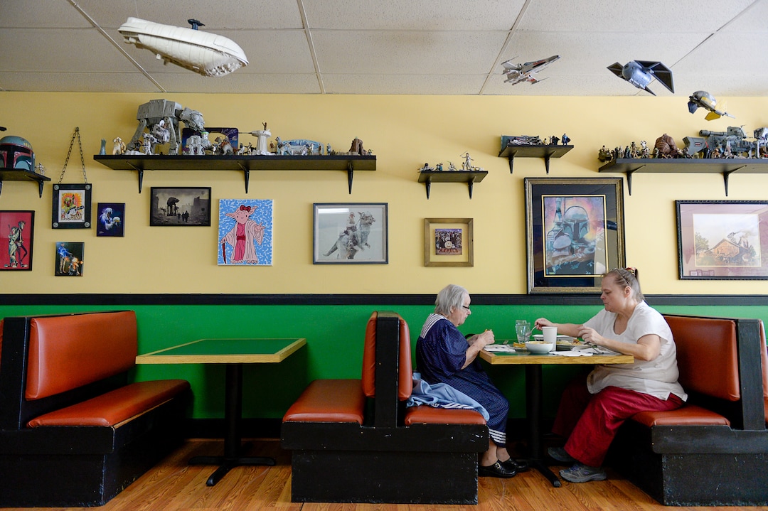 (Francisco Kjolseth  |  The Salt Lake Tribune)  Josephine Carleton, left, and her daughter Ilene eat lunch surrounded by "Star Wars" memorabilia at The Twin Suns Cafe in Sugar House.