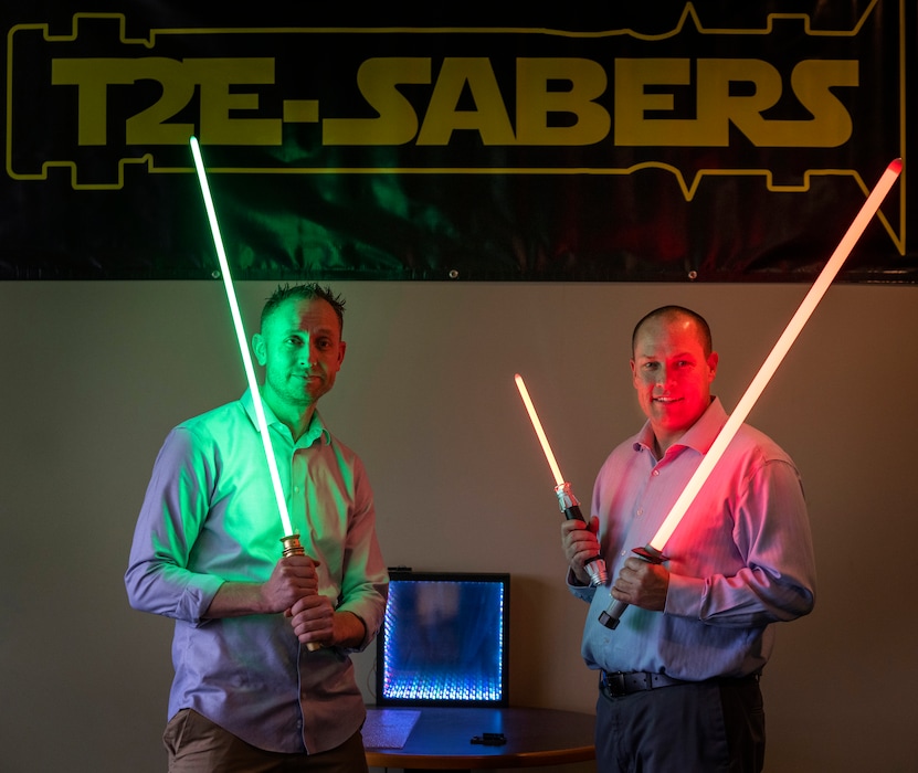 (Rick Egan | The Salt Lake Tribune) Todd Ferrell, left, and Eric Tanner show off the T2E-Sabers made at their company, T2 Engineering in Layton, on Tuesday, Oct. 3, 2023.
