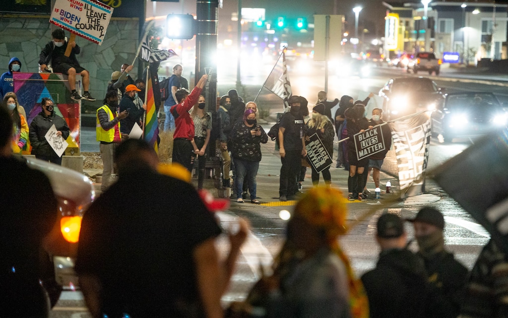 (Francisco Kjolseth  |  The Salt Lake Tribune) Black Lives Matter supporters gather on the corner of 2100 South and State Street in Salt Lake City as they yell back and forth with Trump supporters on the opposite corner near the County Government Center on election night, Tuesday, Nov. 3, 2020.