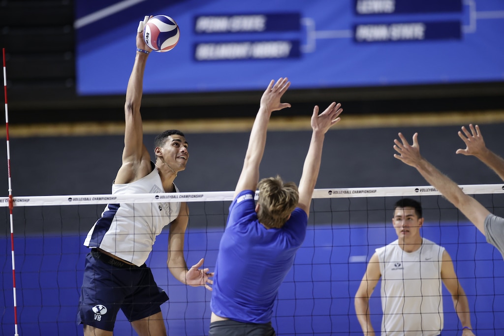 (BYU Photo) Gabi Garcia Fernandez, far left, goes for a kill during practice Wednesday. The Cougars will face Lewis in the NCAA Tournament semifinal on Thursday.