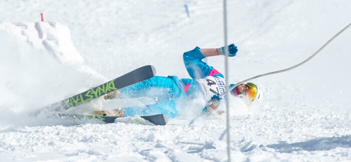 (Rick Egan | The Salt Lake Tribune) Nick Bringhurst crashes as he tries to land a jump, in the Skijoring competition at Soldier Hollow Friday. Feb. 22, 2019.