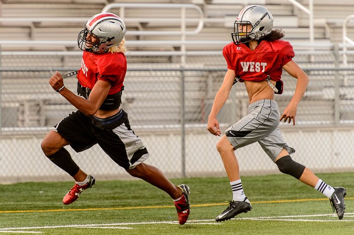 (Trent Nelson | The Salt Lake Tribune)  Viliami Makoni runs the ball, with Treyson Johnson chasing him down, at practice in Salt Lake City, Wednesday September 20, 2017. After back-to-back winless seasons, the West Panthers are slowly starting to get back on track under second-year coach Justin Thompson.