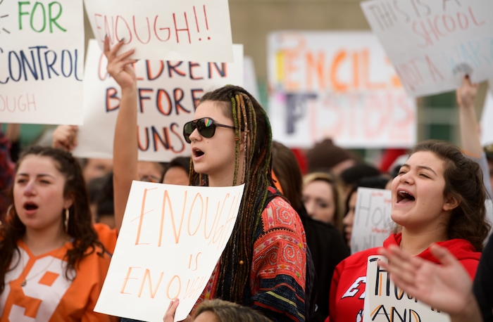 (Leah Hogsten  |  The Salt Lake Tribune) East High School students took to the sidewalk of 13th East to raise awareness and push for change. Exactly one month after 17 people were killed at Marjory Stoneman Douglas High School in Parkland, survivors of the massacre joined tens of thousands of students across the United States by walking out of school,  Wednesday, March 14, 2018. 
