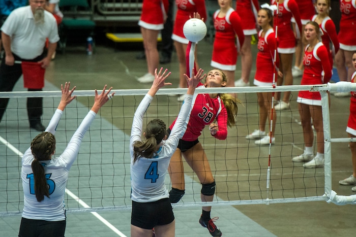 (Chris Detrick  |  The Salt Lake Tribune)  Park City's Grace Stover (38) spikes past Sky View's Morgan Penrose (16) and Sky View's Mikaela Sorensen (4) during the the 4A volleyball state championships at the UCCU Center at Utah Valley University Thursday, October 26, 2017.  
