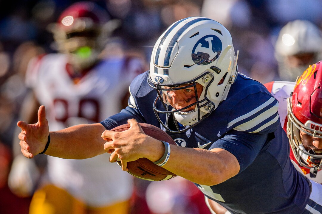 (Trent Nelson  |  The Salt Lake Tribune)  Brigham Young Cougars quarterback Zach Wilson (1) dives for a late touchdown as BYU hosts USC, NCAA football in Provo on Saturday Sept. 14, 2019.