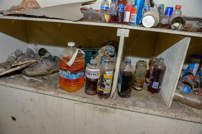 (Trent Nelson | The Salt Lake Tribune) Garbage from squatters fills the basement of a dilapidated, fire-damaged building near 100 South 700 East in Salt Lake City, Thursday Feb. 15, 2018. Other Side Academy has received approval to demolish it for their expansion.