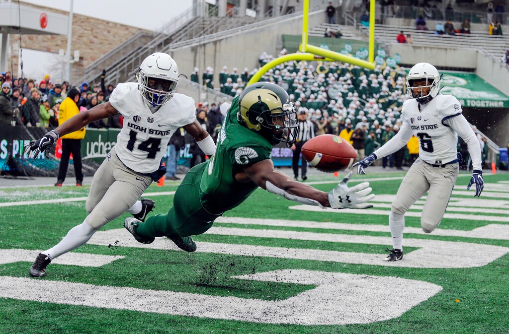 Colorado State wide receiver Warren Jackson (9) misses a pass in the end zone as Utah State cornerbacks Zahodri Jackson (14) and Cameron Haney (6) defend during the second half of an NCAA football game Saturday, Nov. 17, 2018, in Fort Collins, Colo. The Aggies return to Canvas Stadium on Saturday for the season finale for both one-win teams. (AP File Photo/Jack Dempsey)