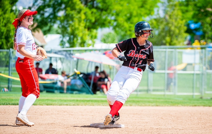 (Isaac Hale | Special to The Tribune) Spanish Fork’s Kiley Mitchell (7) steps onto second base after stealing it on a wild pitch during the second game of a best-of-three series between the Spanish Fork Lady Dons and the Mountain Ridge Sentinels as part of the 5A state softball championship held at the Spanish Fork Sports Park on Friday, May 28, 2021.