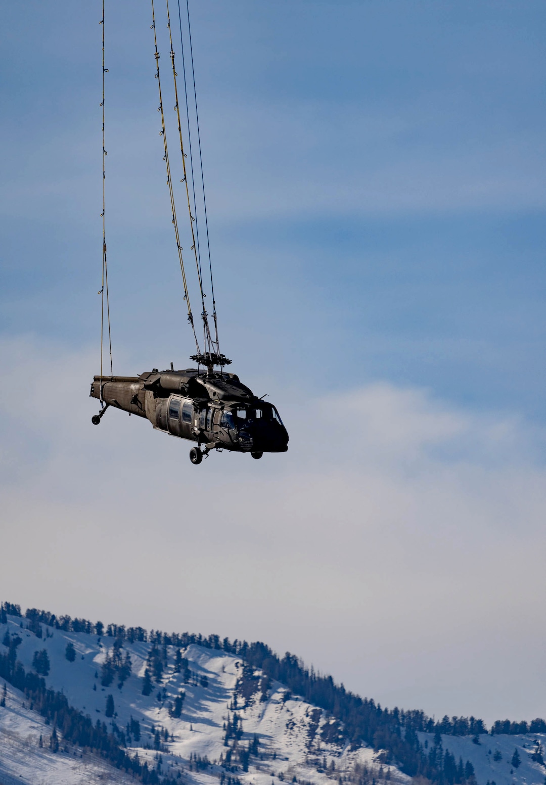 (Francisco Kjolseth | The Salt Lake Tribune) Recovery operations for two Utah Army National Guard UH-60 Black Hawk helicopters involved in a training accident in the Mineral Basin area last week are performed by a CH-47 Chinook helicopter and brought to the Heber Valley Airport on Wednesday, March 2, 2022.