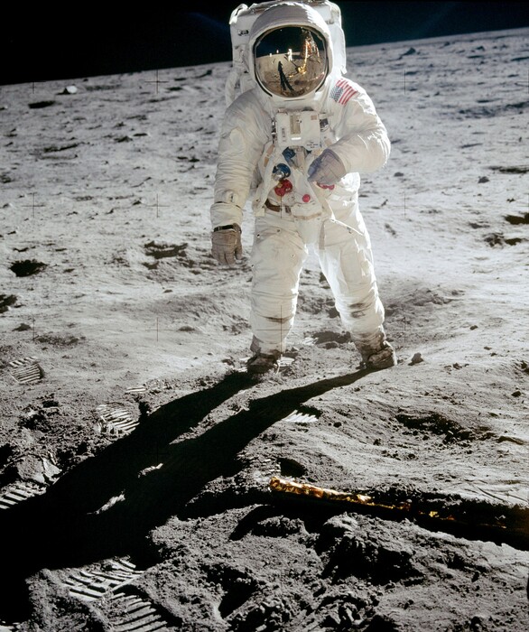 (Photo courtesy of Neil Armstrong | NASA via AP) In this 1969 photo released by NASA, astronaut Buzz Aldrin walks on the surface of the moon near the leg of the lunar module Eagle during the Apollo 11 mission. Astronaut Neil Armstrong, who took the photograph, is reflected in Aldrin's visor.
