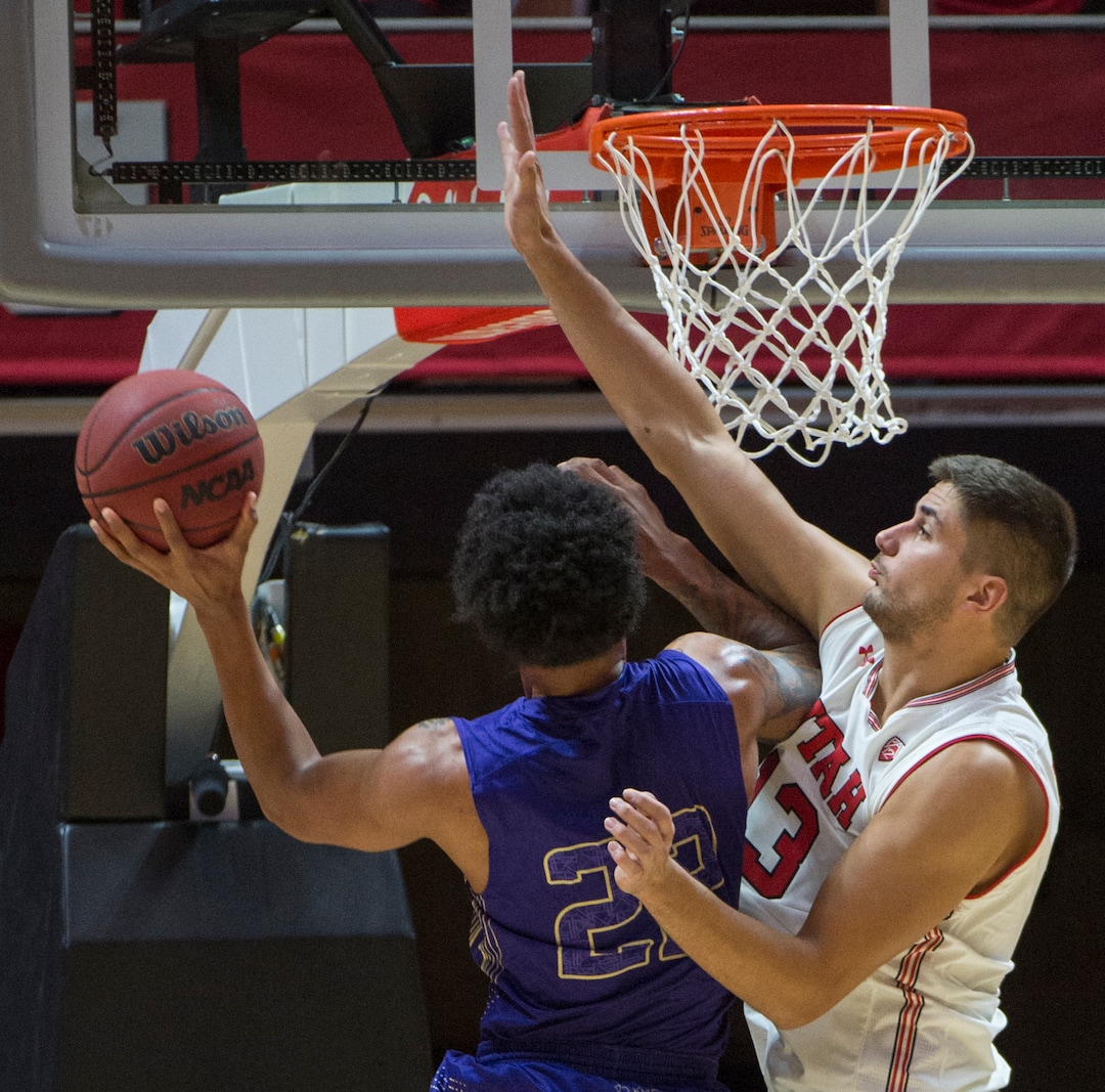 (Rick Egan  |  The Salt Lake Tribune)     Keun Palu-Thompson (22) College of Idaho, shoots, as Utah Utes forward Novak Topalovic (13) defends, in basketball action, between the Utah Utes and the College of Idaho Yotes at the Jon M. Huntsman Center, Thursday, Nov. 1, 2018.