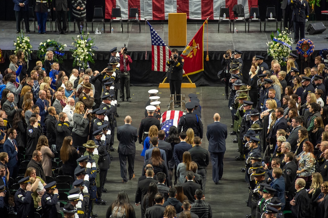 (Rick Egan  |  The Salt Lake Tribune)     The funeral procession enters the Maverik Center for the funeral for South Salt Lake police officer, David Romrell, who died after being struck by a car during a clash with two burglary suspects on Nov. 24. Wednesday, Dec. 5, 2018.