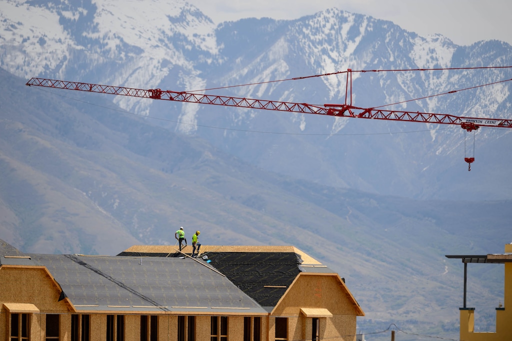 (Trent Nelson  |  The Salt Lake Tribune) Workers building new townhomes in Daybreak on Thursday, April 30, 2020.