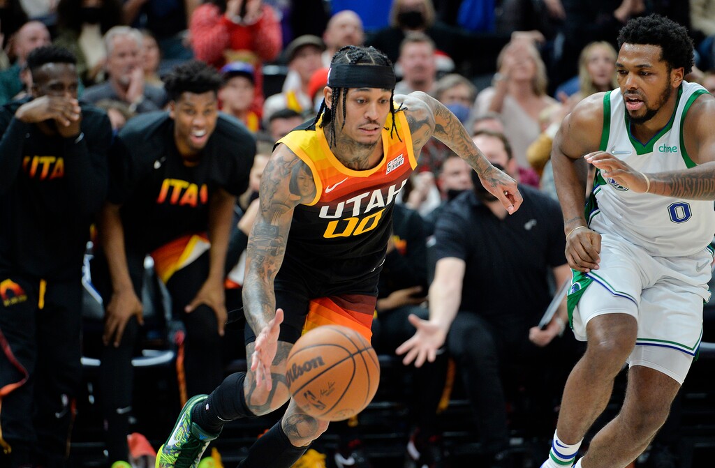 (Chris Samuels | The Salt Lake Tribune) The Jazz bench reacts as guard Jordan Clarkson (00) steals the ball from guard Sterling Brown (0) as the Utah Jazz play the Dallas Mavericks at Vivint Arena Saturday, Dec. 25, 2021.