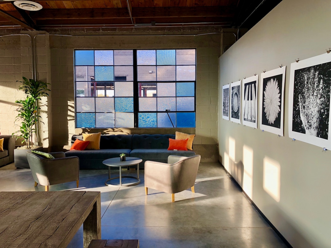 (Courtesy photo) The original building windows highlight modern furniture at T.F. Brewing, a new German-style bar that opened recently in Salt Lake City.