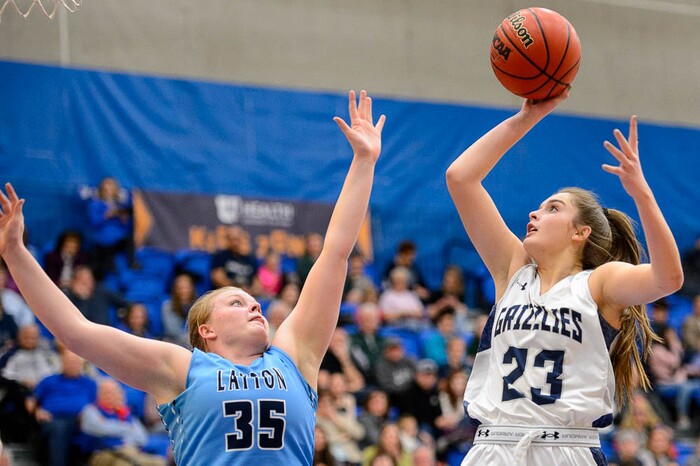 (Trent Nelson | The Salt Lake Tribune)  Copper Hills's Breaunna Gillen (23) shoots over Layton's Meg Edwards (35) as Layton faces Copper Hills in the 6A High School Girls' Basketball Tournament at SLCC in Taylorsville, Thursday Feb. 22, 2018.