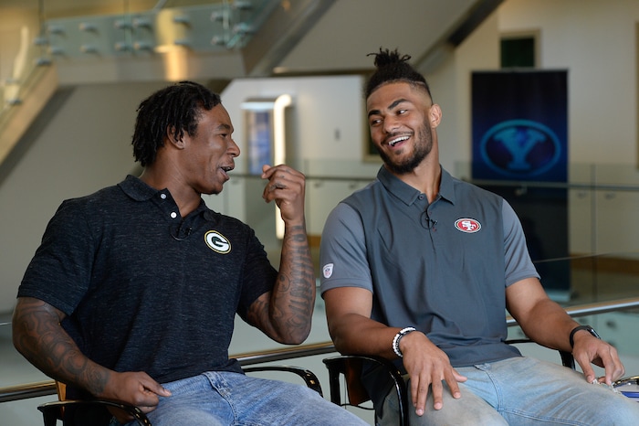 (Francisco Kjolseth  |  The Salt Lake Tribune)  Former BYU football players gone pro Jamaal Williams, left, with the Green Bay Packers and Fred Warner now with the San Francisco 49ers tease each other during an interview as BYU hosts their eighth-annual football media day at the BYU-Broadcasting Building on Friday, June 22, 2018.