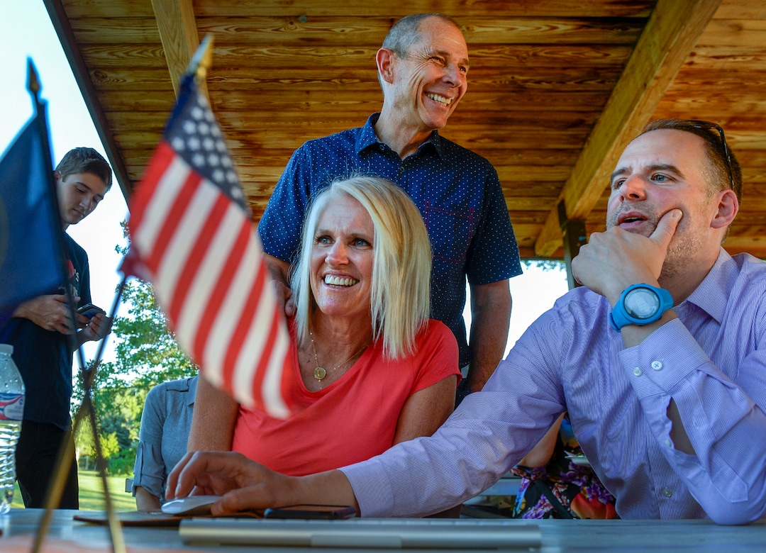 Leah Hogsten  |  The Salt Lake Tribune  Rep. John Curtis, wife Sue and Corey Norman, chief of staff are all smiles as election night results arrive shortly after the polls closed.  Curtis defeated Republican primary opponent Chris Herrod for the 3rd Congressional District seat at his election party June 26, 2018 at Riverview Park in Provo.