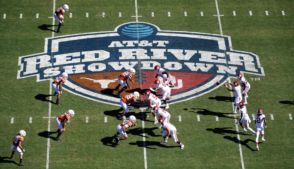 (Jeffrey McWhorter | AP) Oklahoma, right, runs a play against Texas in the first half of an NCAA college football game at the Cotton Bowl in Dallas, Oct. 12, 2019. The Big 12 is losing its marquee matchup when the Red River Rivalry is played Saturday for the final time under the league’s umbrella.