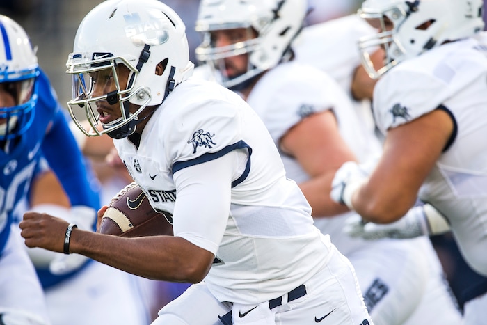 (Chris Detrick  |  The Salt Lake Tribune)  Utah State Aggies quarterback Kent Myers (2) runs the ball during the game at Merlin Olsen Field at Maverik Stadium Friday, September 29, 2017.