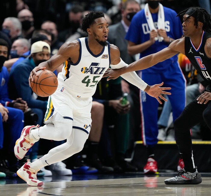 (Francisco Kjolseth | The Salt Lake Tribune) Utah Jazz guard Donovan Mitchell (45) drives the ball in NBA action between the Utah Jazz and the LA Clippers at Vivint Smart Home Arena in Salt Lake City, Wednesday, Dec. 15, 2021.