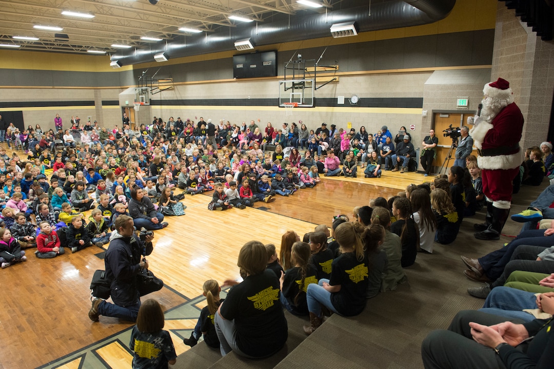 (Rick Egan  |  The Salt Lake Tribune) Santa tells the students a story at Centennial Elementary School, in Roosevelt, Utah, as volunteer pilots from the Utah Wing of Angel Flight West, brought school supplies and gifts to students on their annual Santa Flight. Friday, December 8, 2017.