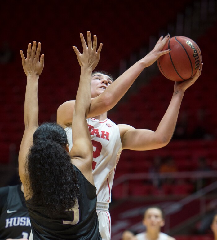 (Rick Egan  |  The Salt Lake Tribune)      Utah Utes forward Emily Potter (12) shoots over Washington Huskies forward Fapou Semebene (2) , in PAC-12 women's basketball action at the Jon M. Huntsman Center, Sunday, Feb. 18, 2018.