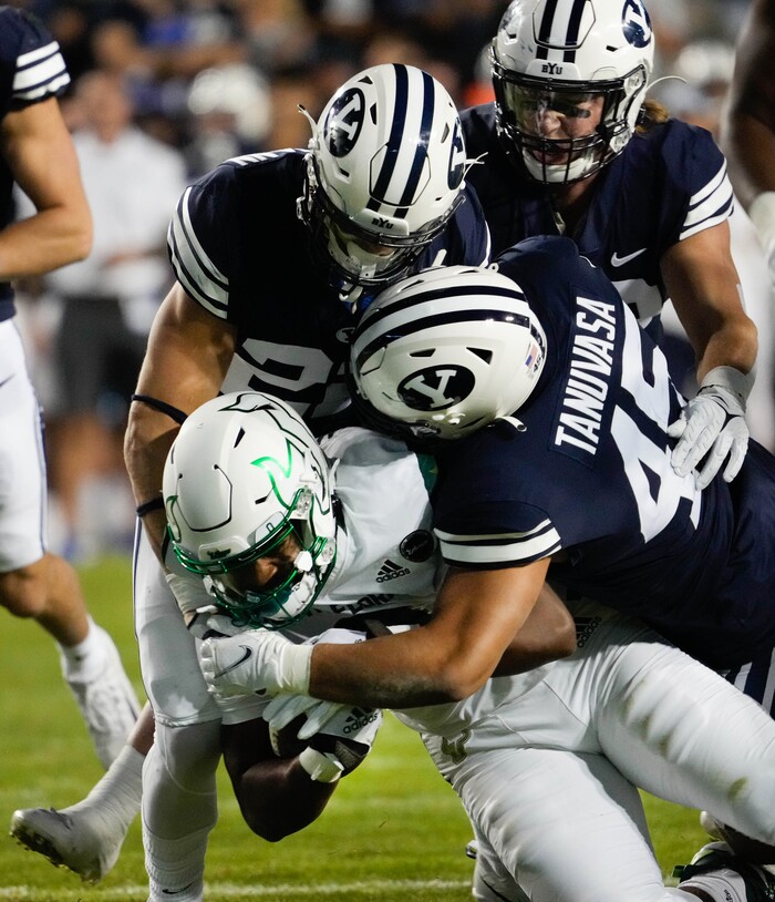 (Francisco Kjolseth | The Salt Lake Tribune) South Florida Bulls running back Jaren Mangham (0) is taken down by the BYU defensive line in game action between the Brigham Young Cougars and the South Florida Bulls at LaVell Edwards Stadium in Provo, Saturday, Sept. 25, 2021.