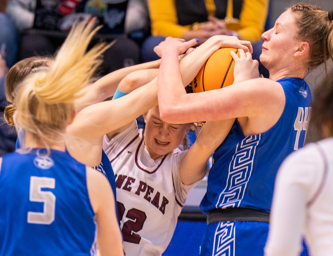 (Rick Egan | The Salt Lake Tribune) Fremont Center, Maggie Mendelson (44) ties up Lone Peak forward, Naia Tanuvasa (32), in the 6A State Championship game between Fremont and Lone Peak, at the Marriott Center in Provo, on Saturday, March 5, 2022. 