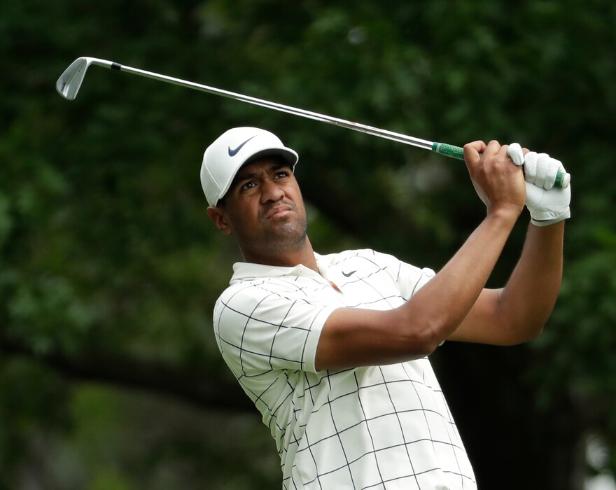 Tony Finau hits from the fourth tee during the third round for the Masters golf tournament Saturday, April 13, 2019, in Augusta, Ga. (AP Photo/Chris Carlson)