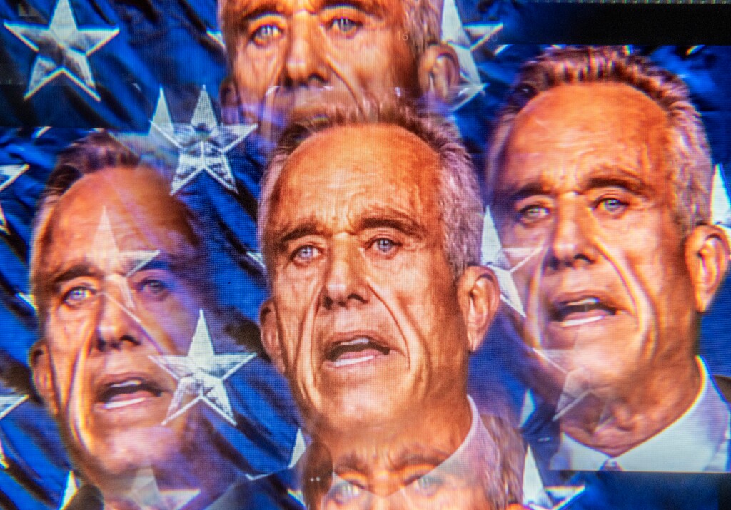 In a multiple-exposure image made from a video being played at the event site, Robert F. Kennedy Jr. campaigns in Goffstown N.H. on June 20, 2023. (Mark Peterson/The New York Times)