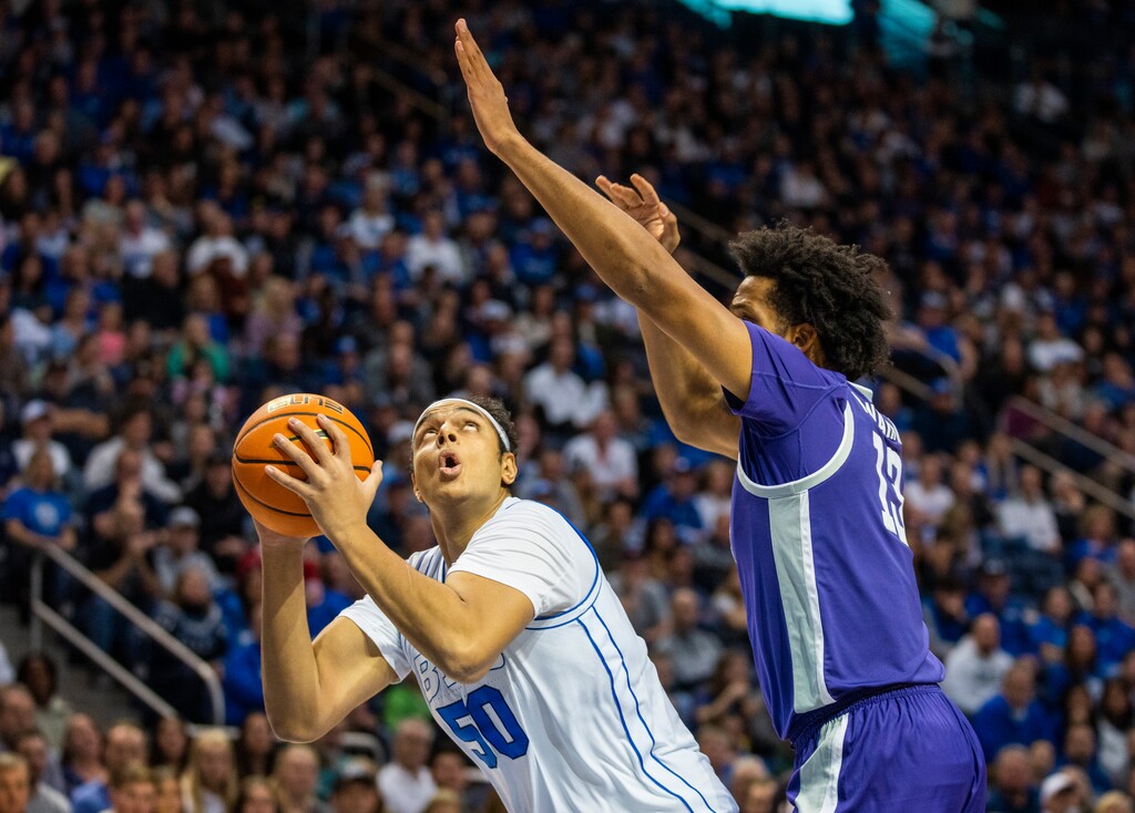 (Rick Egan | The Salt Lake Tribune) Brigham Young Cougars center Aly Khalifa (50) looks for a shot as Kansas State Wildcats forward Will McNair Jr. (13) defends, in basketball action between the Brigham Young Cougars and the Kansas State Wildcats, at the Marriott Center, on Saturday, Feb. 10, 2024.