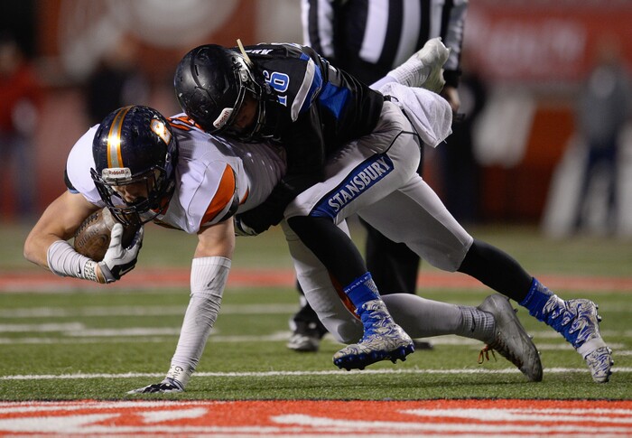 (Francisco Kjolseth  |  The Salt Lake Tribune)  Nicholas Nethercott of Mountain Crest is taken down by Kooper Roudy of Stansbury in their class 4A semifinal game at Rice-Eccles Stadium, Thursday, Nov. 9, 2017.